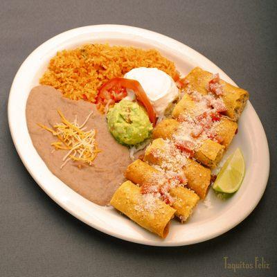 Taquitos Rancheros - Chicken crispy taquitos, with a side of rice and beans and a scoop of sour cream and guacamole with queso fresco.