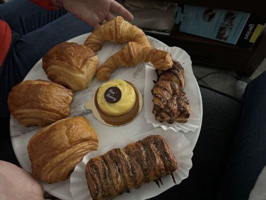 Pain au chocolat, hazelnut sticky bread, salted caramel sticky bread, croissant, lime tartlet