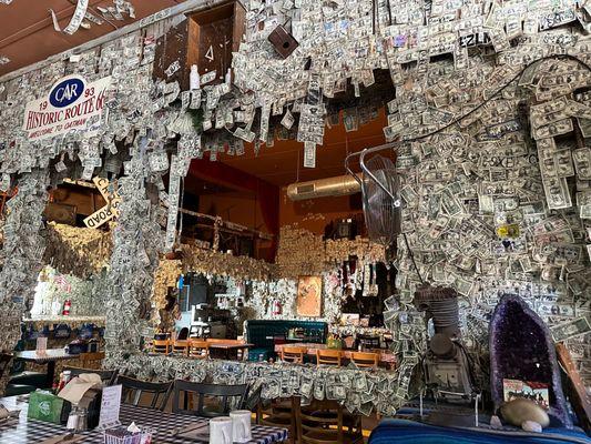 Another divey restaurant/bar decorated in thousands of dollar bills.