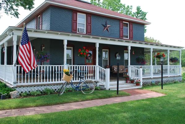 Enjoy the 3 season wrap around porch with lovely country views