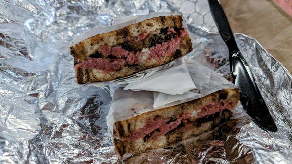 Grilled pastrami with Swiss cheese