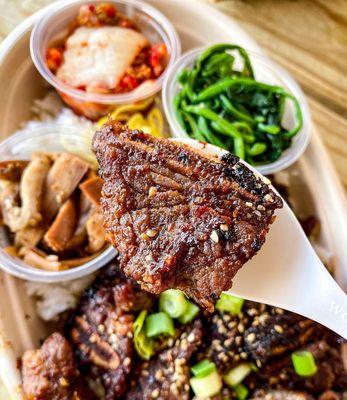 LA Galbi Rice Bowl, with kimchi, eggplant, and spinach! photo by @kerryout_delivery on instagram.