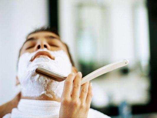 Straight razor shave with hot lather and hot towels