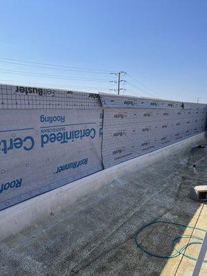 Commercial building parapet wall Dura Temp siding installation