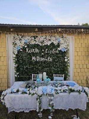 Sweetheart table with white chivary chairs