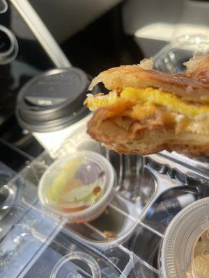 Egg cheese croissant  with fruit cup and cookies