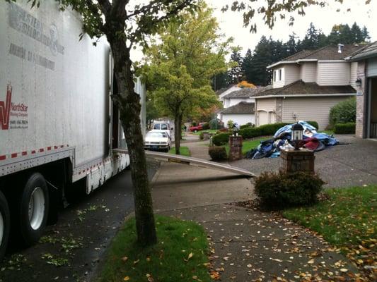 Large moving truck being unloaded