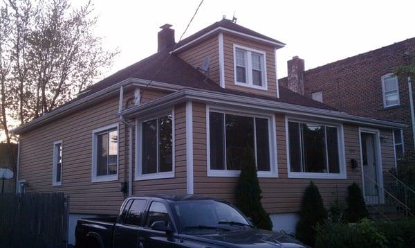 This home in Hackensack, NJ enclosed its front porch, installed new windows, roofing, gutters, and insulated siding.