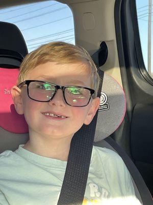 Kiddo in his new glasses!