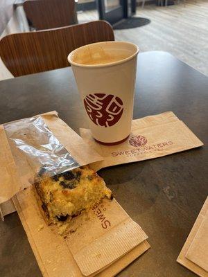 Almond milk latte and a warmed blueberry scone