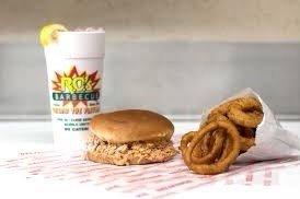 An awesome large BBQ sandwich with their secret recipe, deep fried onion rings and their specialty an ice cold "Cherry Lemon Sundrop" soda!