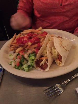 Fish tacos with fries.