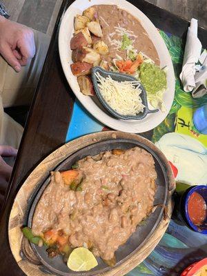 Vegan fajitas with extra refried beans