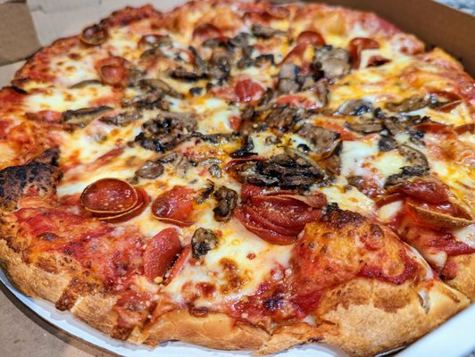 14-inch Loaded Pepperoni pizza ($21.49) with Mushrooms (+$1.25).