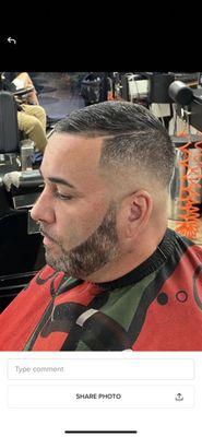 Skin tight fade with comb over part beard line