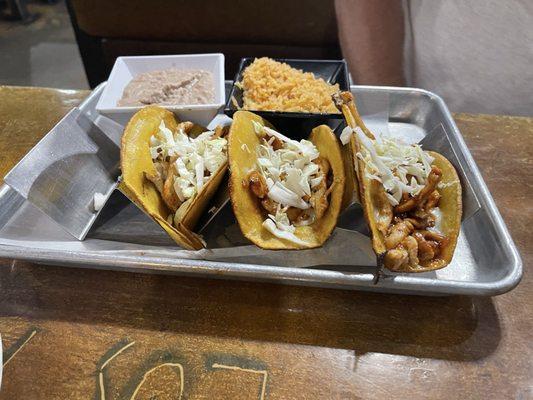 Chicken tacos with slaw and the rice & beans to the side.