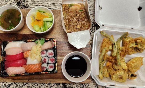 Sushi deluxe with cucumber salad and miso soup, jumbo shrimp fried rice, and vegetable tempura