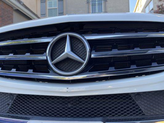 Front grille is almost out of place from its clips.