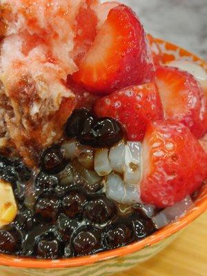 Strawberry shaved ice cream with pudding, tapioca, herbal jelly, lychee jelly (asian Jello-O), and condensed milk. SOOOO GOOD!!!