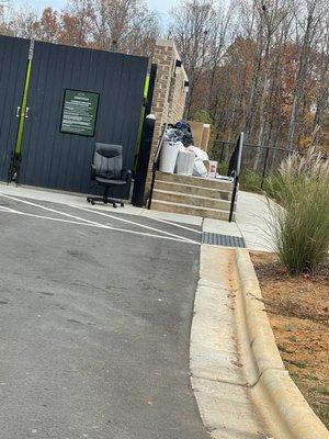 The trash compactor always looks like this. The door is too heavy for residents or they'll just start piling it up aimlessly.