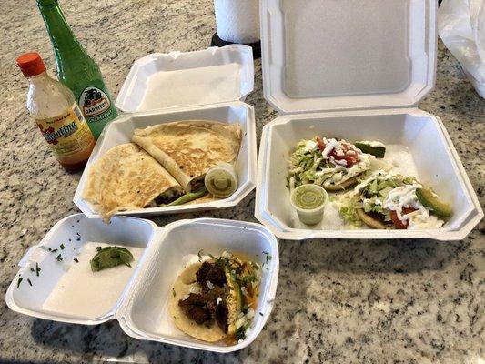 Taco de lengua, sopes con asada y quesadilla de asada. Not pictured are the other two sopes con pollo.