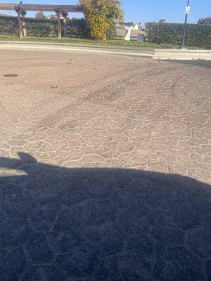 Tire damage from dump trucks driving through seal coat and spreading it all over our entrance.