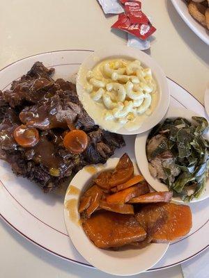 Slow cooked Oxtails Candied Yams Trio of Greens Mac and Cheese