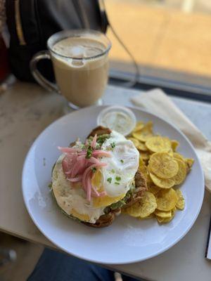 Avocado toast w/ egg and pickled onion with a side of plantain chips.