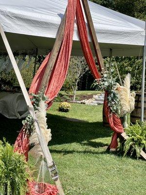 Boho vibes with Terra Cotta Velvet, Ferns, and glass jugs of Pampas Grass with eucalyptus accents.