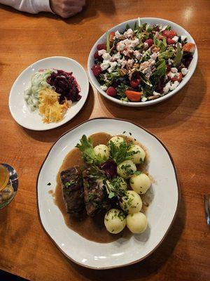 Beef rollups with dumplings and gravy  and a summer berry salad