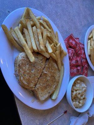 Ruben with fries and a side of Mac and cheese