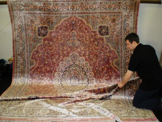 Pictured is a silk Oriental rug that has been hand washed. The rug is now dry and ready to go home.