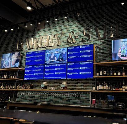 Bar area with TVs and plenty of taps and seating in bar area.