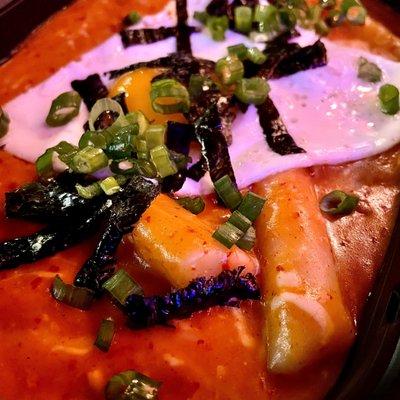 Tteokbokki with "Pink" sauce (combo of spicy red and creamy white) + fried egg and cheese