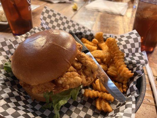 Fried chicken sandwich and seasoned crinkle fries.