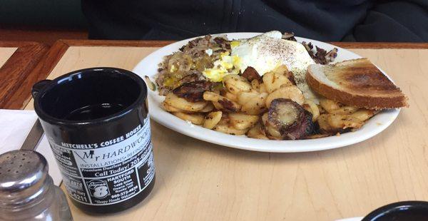 Home made roast beef hash, eggs, spuds, & toast.