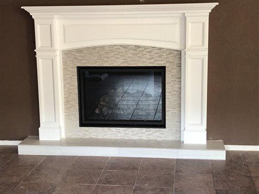 Custom hearth, mantle, and backsplash.