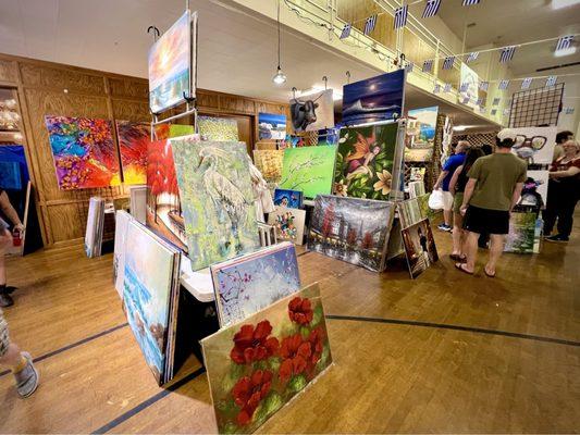 One of the stalls in the festival market selling lovely paintings