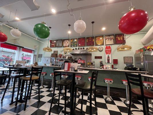 Really cool 50's theme, done well, with local stuff.
 Not a chain store thing...this is a real local place. Those uniforms are from locals