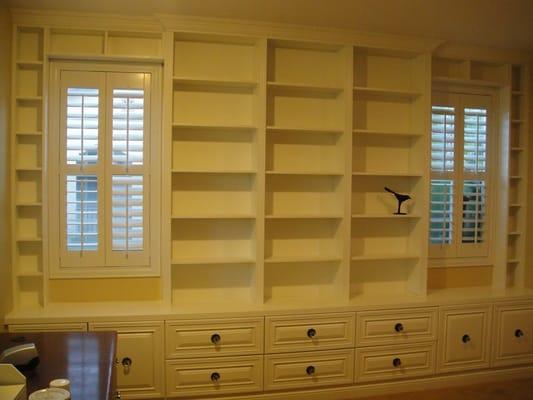 i custom made these built-in bookcases and they got topped off with restoration door knobs.