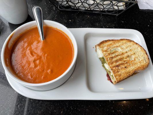 Half caprese panini and tomato soup