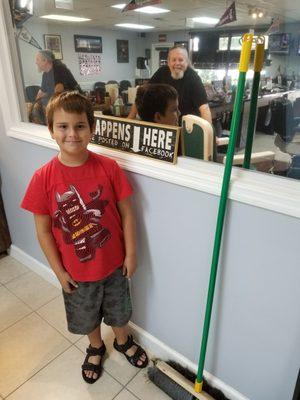 7 year old William stopping in to see Bob, his barber.