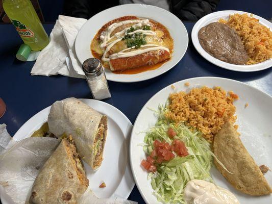 Enchilada (Tuesday-only dinner special), beans and rice, the best barbacoa burrito you'll find anywhere, crispy chicken empinadas