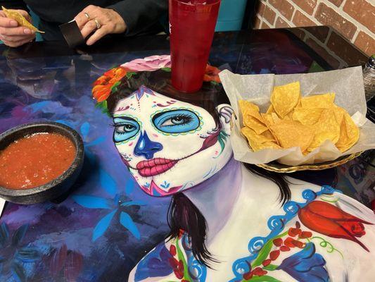 Salsa and chips on the decorated table