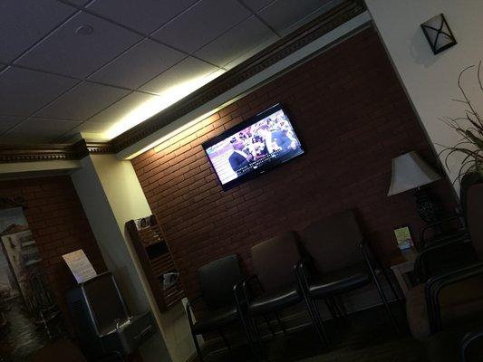 Comfortable waiting area with multiple TVs