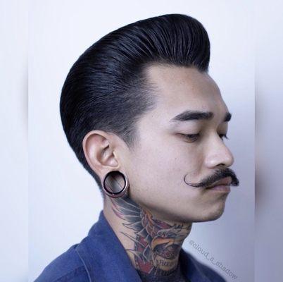 Blow dried pompadour with some light pomade.