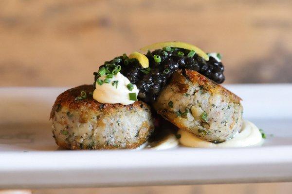 Potato cakes with beluga lentil caviar