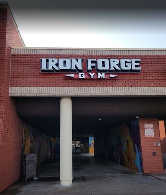 The newly installed Iron Forge Gym sign out front.