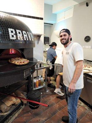 Nick, one of the owners is a master at preparing the perfect pizza!