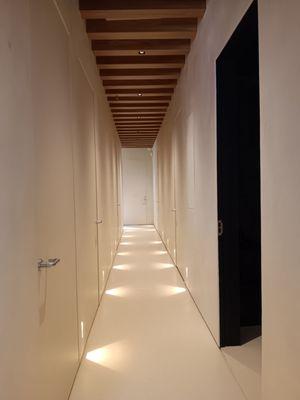 New med spa hallway with new wooden ceiling beams,